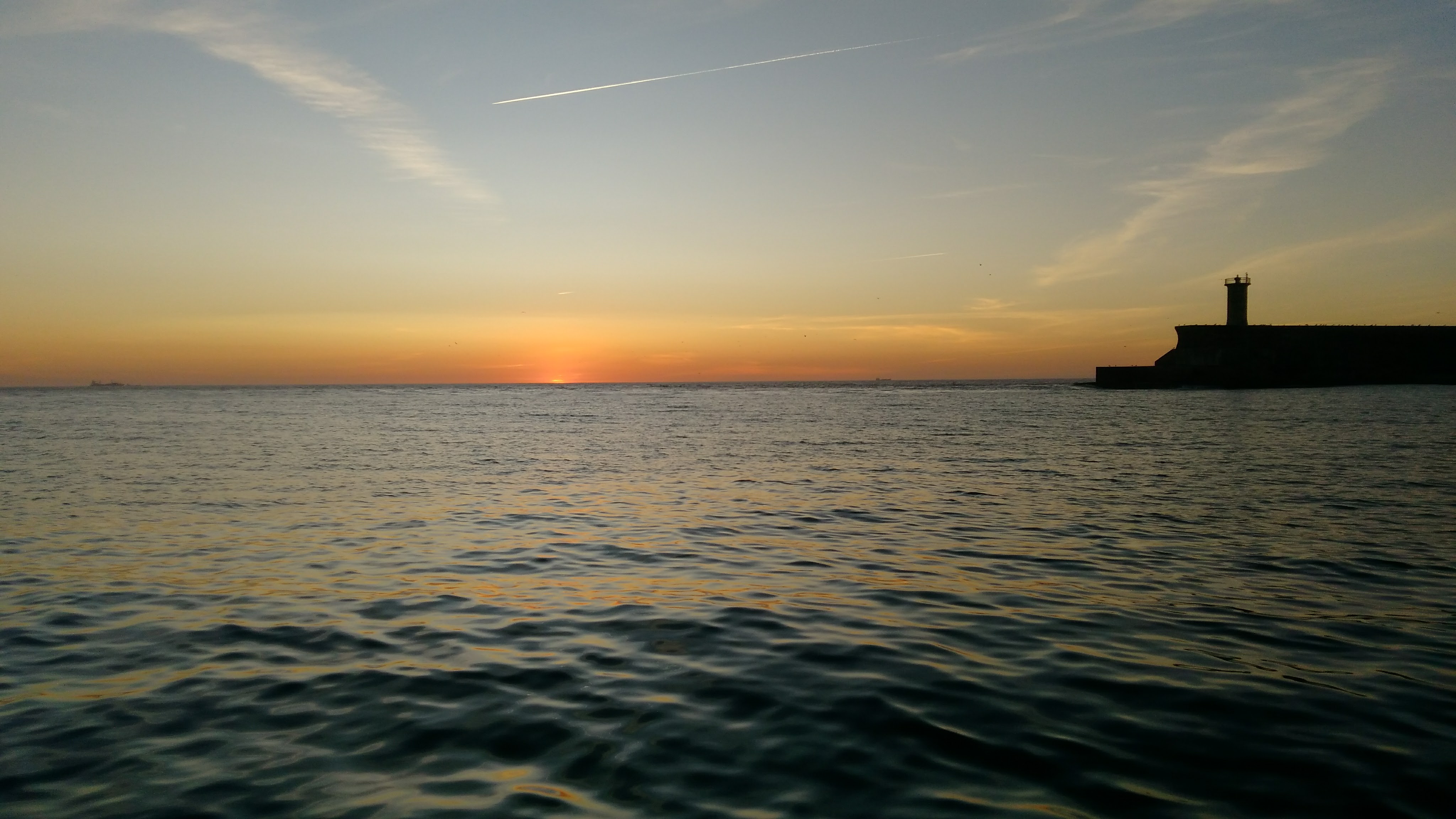 Sunset prior to recovery at the harbor entrance.